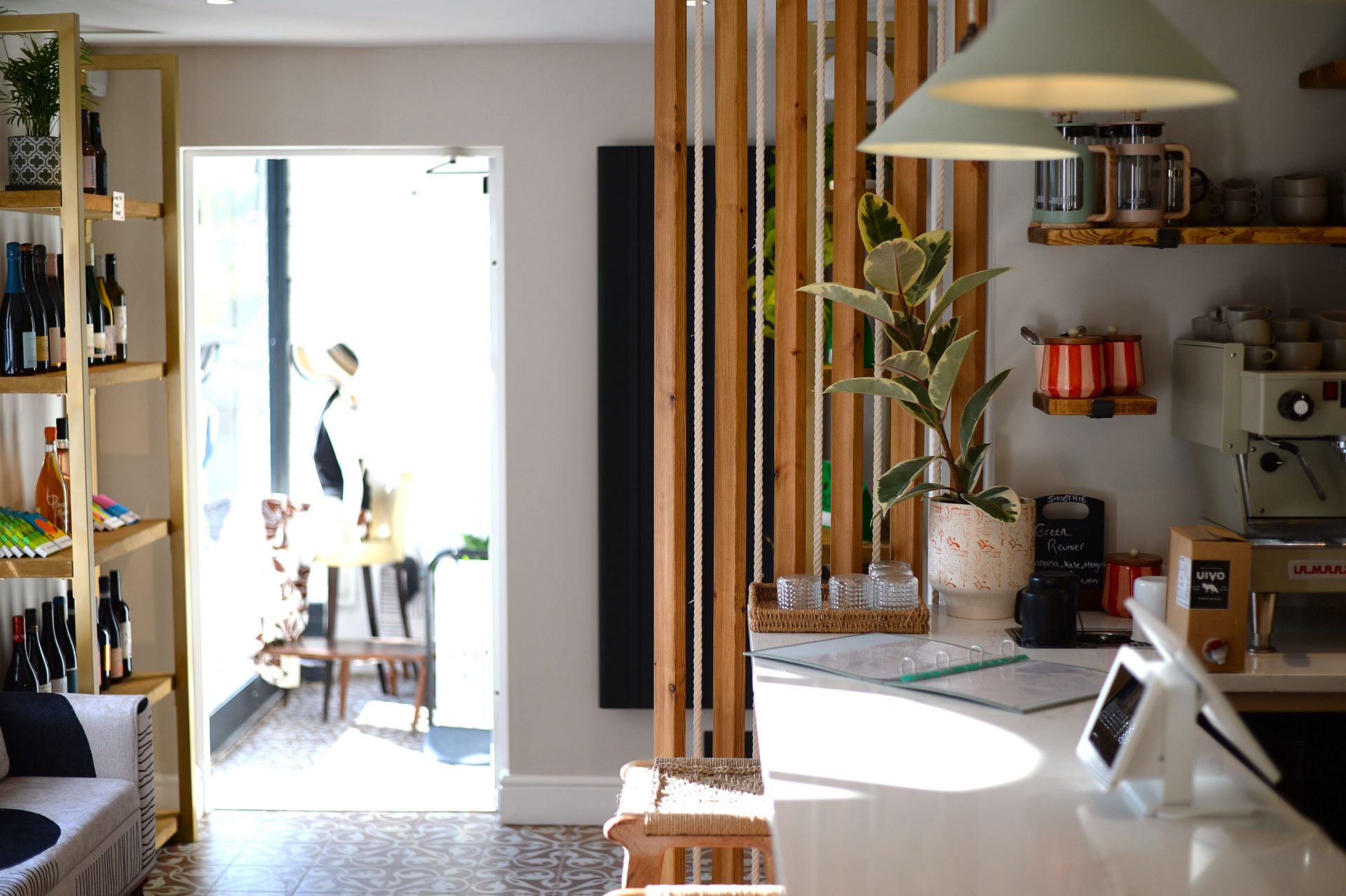 Warm timber, coffee equipment and wine shelves inside Joy